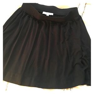 Black skirt- mid leg length above knee